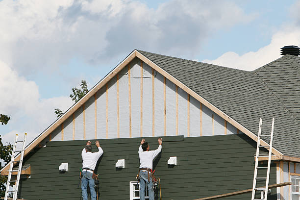 Professional Siding technician working in Tilghman, MD